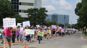 About a thousand people march south on Main Street in downtown Wichita for abortion rights. Kylie Cameron/KMUW