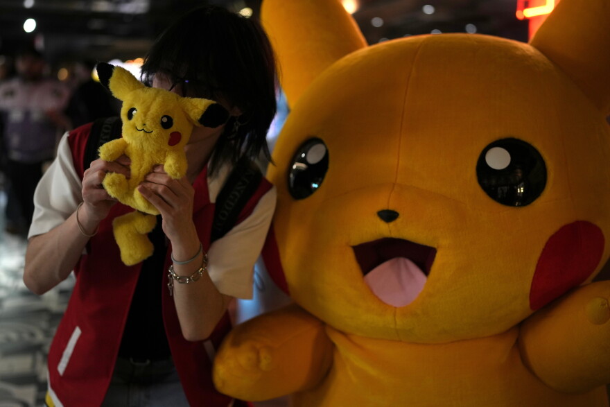 A fan poses for a photograph during Pokemon Day, as they celebrate the 30th anniversary of Pokemon, in London, Friday, Feb. 27, 2026.