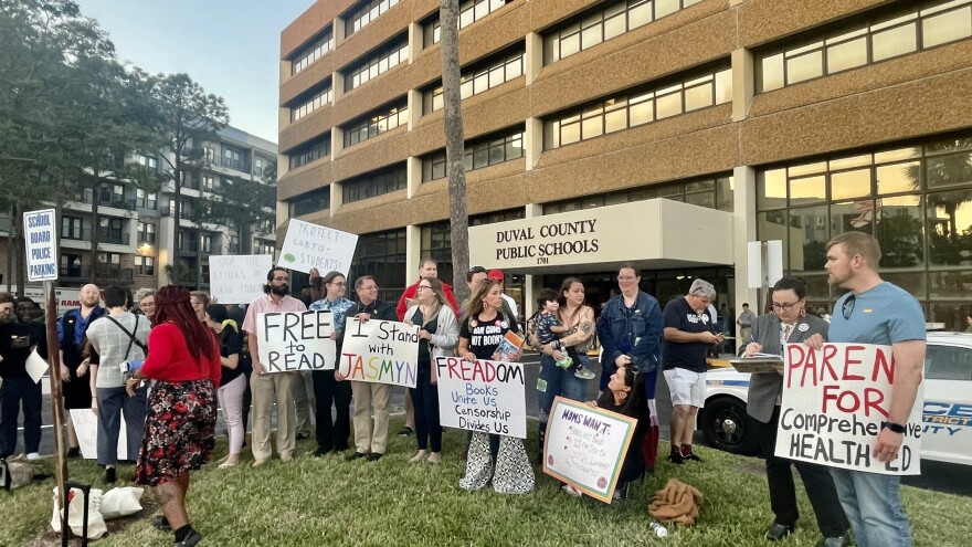 Parents rallied ahead of a December school board meeting over the district's months long review of books from the Essential Voices classroom library collection. 