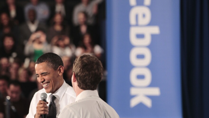 President Obama shares a laugh with Facebook CEO Mark Zuckerberg during a town hall meeting earlier this year on reducing the national debt.