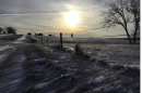A Nebraska farm field with a dusting of snow.