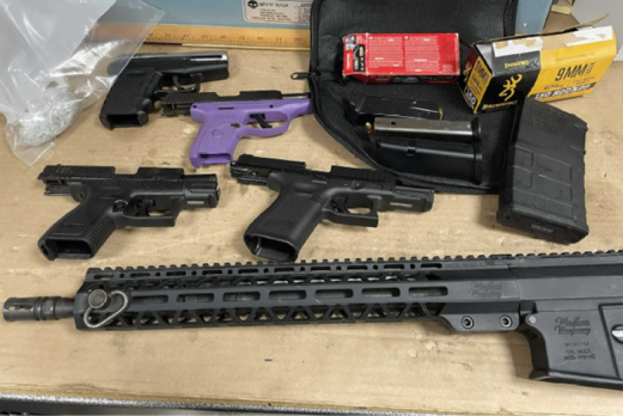 Trial exhibit photo of firearms.