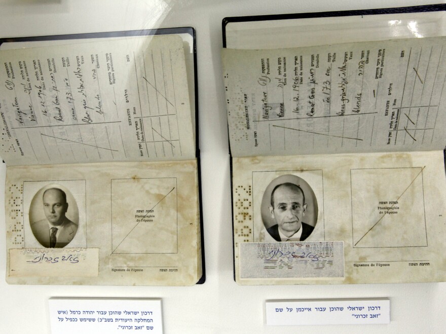 Fake passports used by an Israeli Mossad agent (left) and another one manufactured to fly Adolf Eichmann (right) out of Argentina are displayed in an exhibition in Jerusalem in 2011, commemorating the 50th anniversary of the verdict against Eichmann.