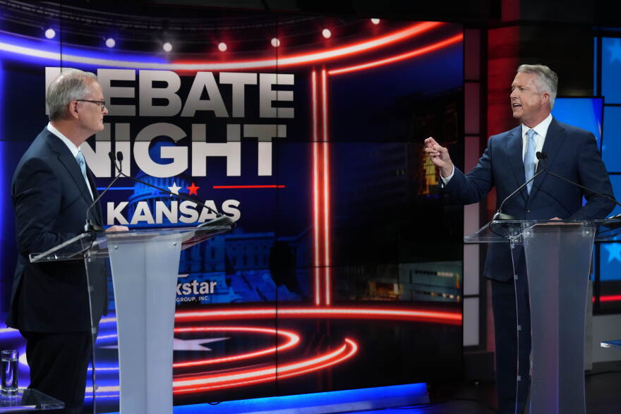 Republican Sen. Roger Marshall, right, and Democratic nominee for U.S. Senate Adam Hamilton participate in a debate in Kansas City, Mo., Wednesday, Oct. 21, 2026. (AP Photo/Charlie Riedel, Pool)