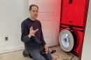 Dwayne Petko conducts a blower door test and explains how it works at a house in Sunbury, Ohio.