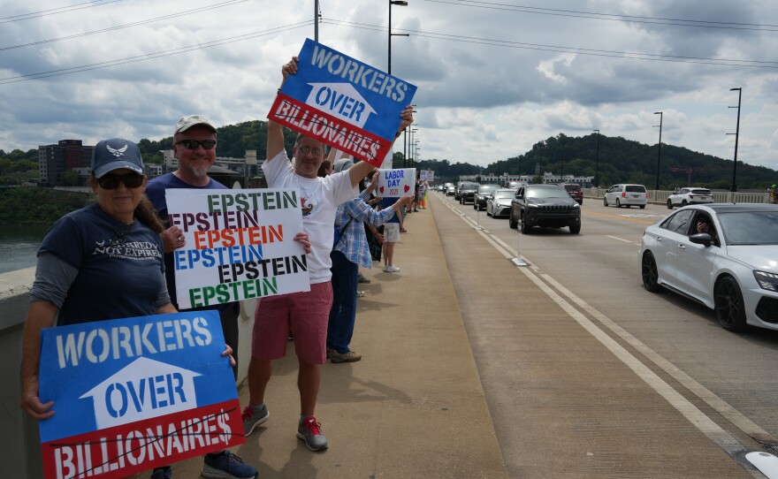 Demonstrators participate in Indivisible Knoxville’s Labor of Love protest on Henley Street Bridge in Knoxville on September 1, 2025.