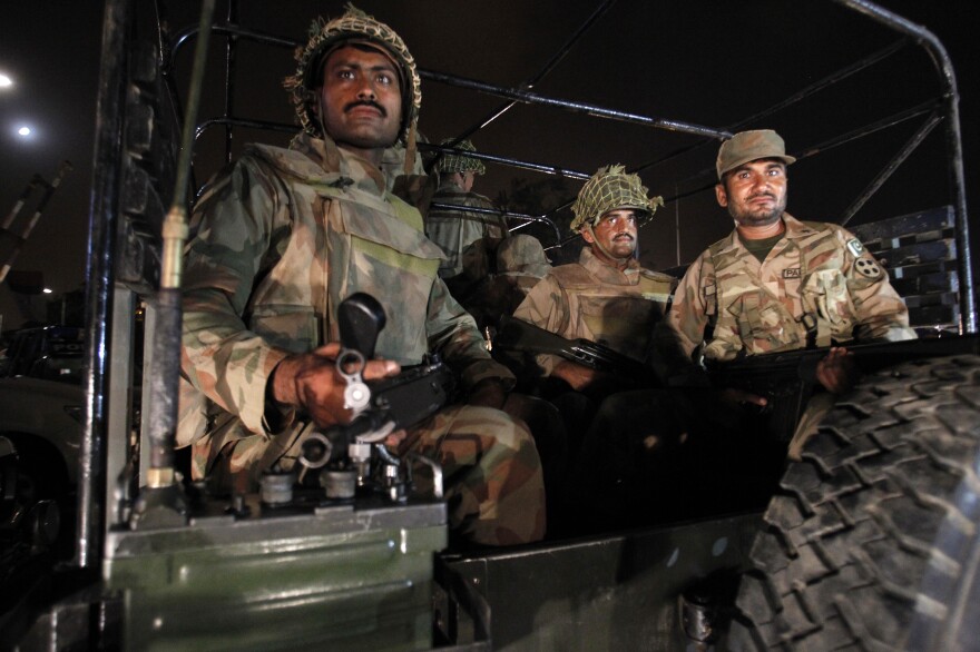 Pakistan army troops arrive at Karachi airport following an attack on June 8 by the Pakistani Taliban. More than 30 people were killed, and the military has now launched an offensive against the Taliban.