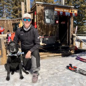 Avalanche rescue dog Mona and Erik Larsen at Mona's retirement party in Telluride, Colorado.