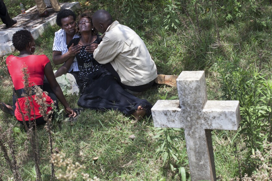 Family, friends and colleagues attend the funeral of Ruth Njeri Macharia at Langata Cemetery in Nairobi. Macharia, who worked at the Westgate Mall's Art Cafe, was killed in the attack.