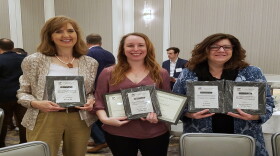 Reporters (from left) Ann Thompson and Tana Weingartner with News Director Maryanne Zeleznik and their awards. 