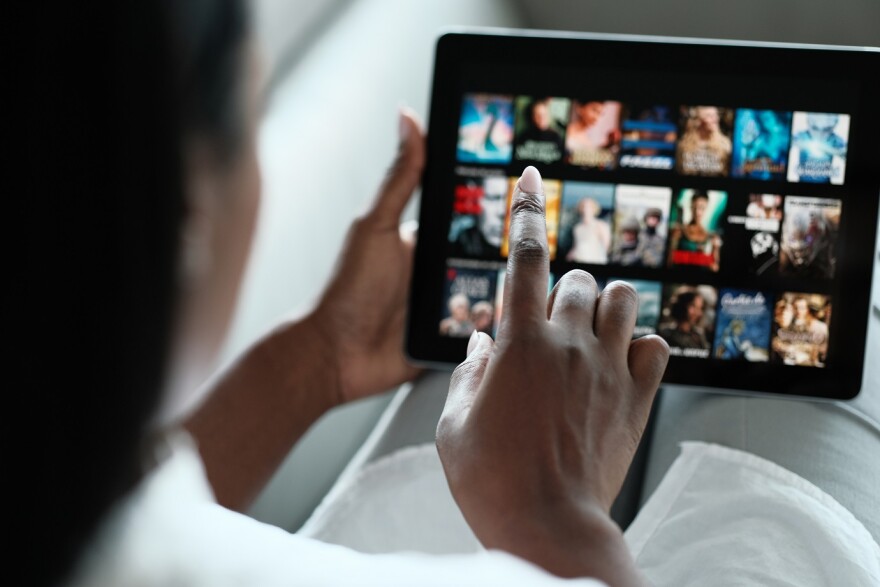 Woman Browsing Movies On Streaming Media Service