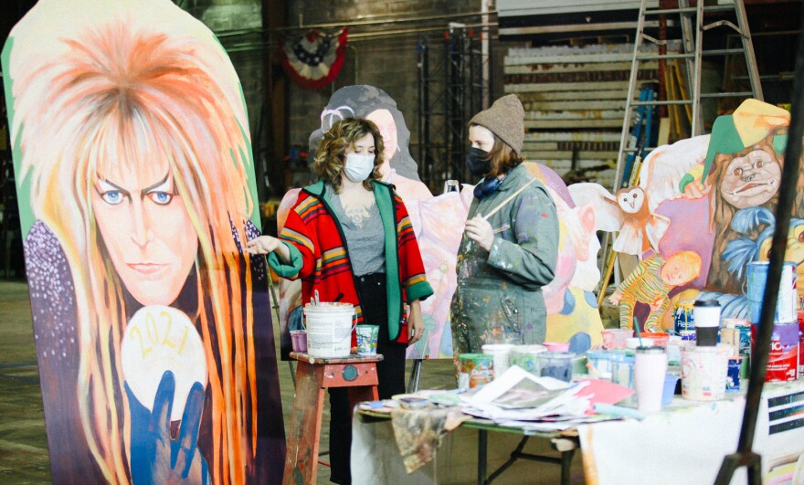 House floats are floating artists an economic life raft during the COVID pandemic. Coco Darrow (L) and Maddie Stratton (R) work on Mardi Gras decorations at The Stronghold Studios in New Orleans.