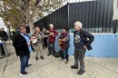 A group of musicians performs at a gathering on the corner of Market and Brockhurst in Oakland.