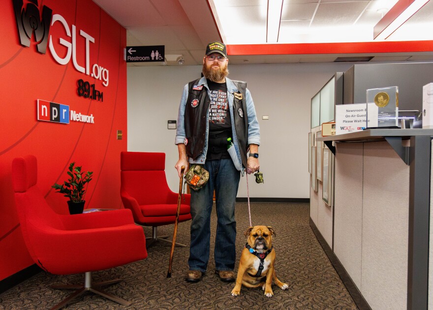 Dennis McDonald and his dog, Belle, at the WGLT studio.