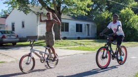 14-year old Alex Brown (right) is one of the lead mechanics at the shop. He's one of a dozen kids working there this summer, with ages ranging from 8 to 18.