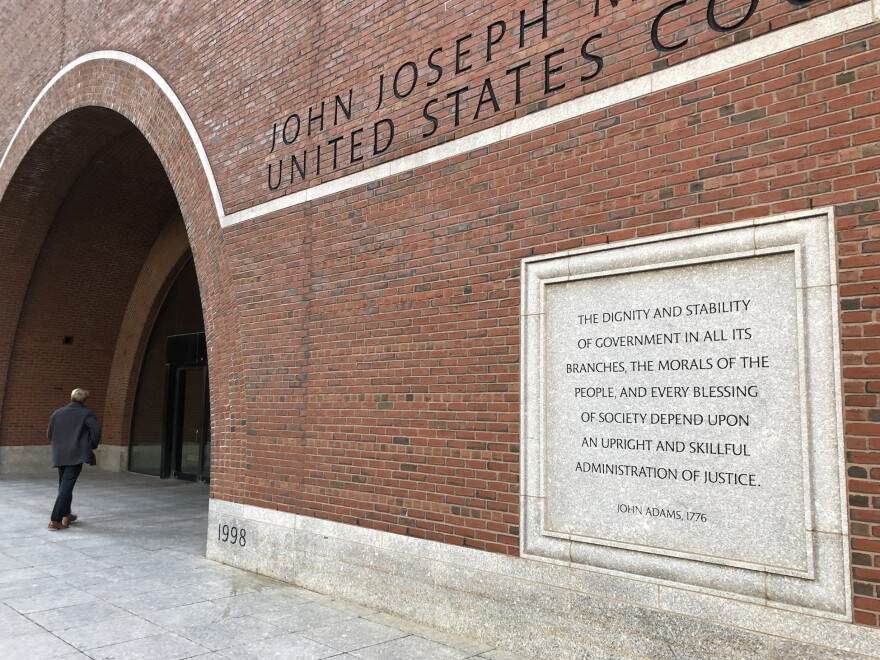 Etchings on the federal courthouse in Boston acclaim a well-administered justice system, but many working in the building say that is getting harder, given the continuing federal shutdown.
