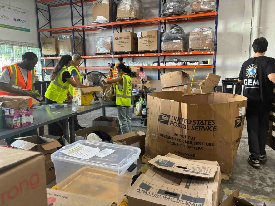 Volunteers at the Global Empowerment Mission’s warehouse in Doral package goods for Hurricane Melissa victims.