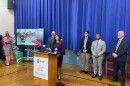 Michael Turza (far right) accompanies Milwaukee Public Schools Superintendent Brenda Cassellius and Milwaukee Mayor Cavalier Johnson (left of Turza) at a news conference regarding the school district's lead paint remediation project on Dec. 17, 2025.