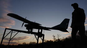 A Ukrainian serviceman launches a drone towards Russian positions at the front line in the Zaporizhzhia region, Ukraine, Oct. 7, 2026. (Andriy Andriyenko/Ukraine's 65th Mechanized Brigade via AP)