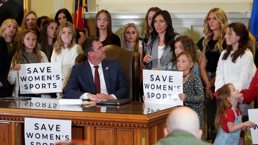 Oklahoma Gov. Kevin Stitt signed the Save Women's Sports Act, which is a ban on transgender student athletes competing in women's sports, on March 30, 2022.