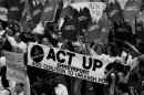 ACT UP Shreveport members marching during the height of the AIDS crisis, carrying the iconic "Silence=Death" banner and signs reading "NIH = National Institutes of Healthcare." Original cover photograph for Small Town Rage: Fighting Back in the Deep South (c. 1990)