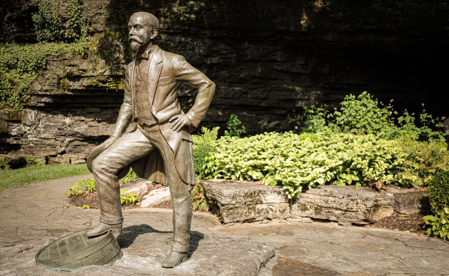 A statue of Jack Daniel outside the cave in Lynchburg, Tenn. that is now at the heart of a distillery tour.