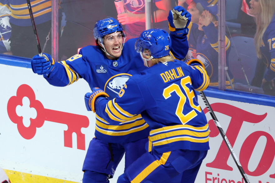 Buffalo Sabres defenseman Rasmus Dahlin (26) celebrates his goal with center Peyton Krebs (19)during the third period of an NHL hockey game against the Chicago Blackhawks Saturday, Oct. 3, 2026, in Buffalo, N.Y. (AP Photo/Jeffrey T. Barnes)