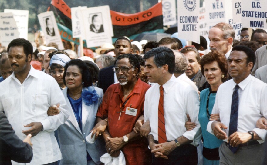 Joseph Lowery, center, marches with Coretta Scott King, Rev. Jesse Jackson, Michael Dukakis, his wife Kitty and Mayor Andrew Young of Atlanta in 1988 during the 25th anniversary of Dr. King's march on Washington, DC.