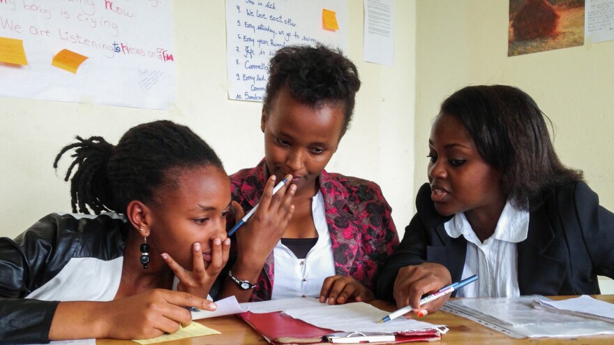 Akilah debate team members (from left) Phylis Kabano, Sonia Rugwiro and Mireille Umutoni prepare to compete in a debate tournament.