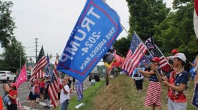 Dozens of Trump supporters waved flags and signs by the side of the road in Doylestown on July 20, 2024.