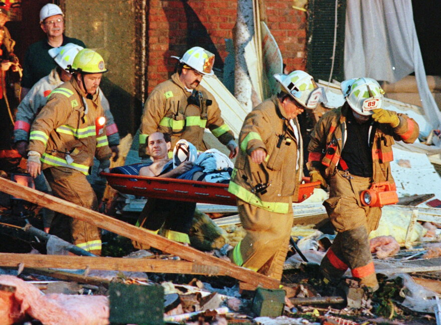 Bernie Franks is taken from the wreckage of his home by firefighters in Montgomery, Ohio, just north of Cincinnati, early Friday morning, April 9, 1999 after his neighborhood was hit by high winds. 