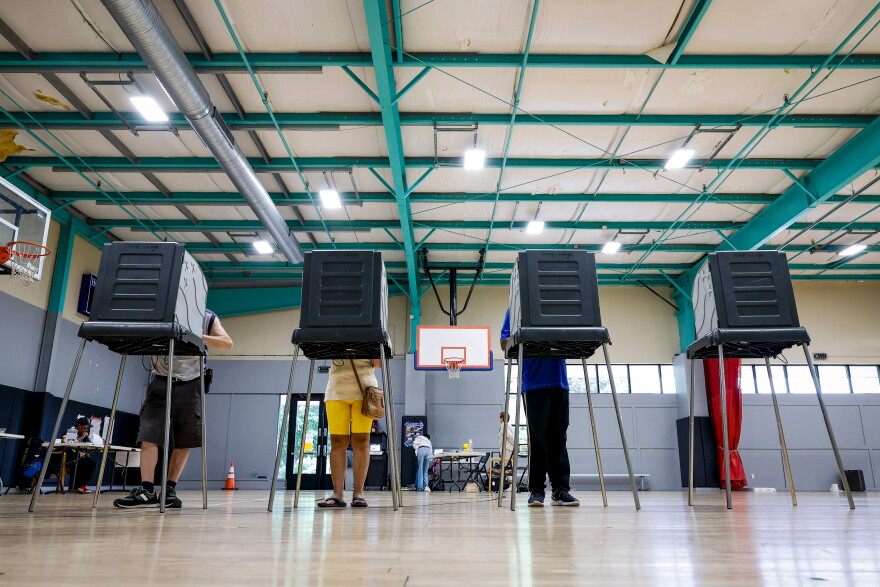 Voters cast their ballots during the primary election in Windsor, Conn., Aug. 11, 2026.