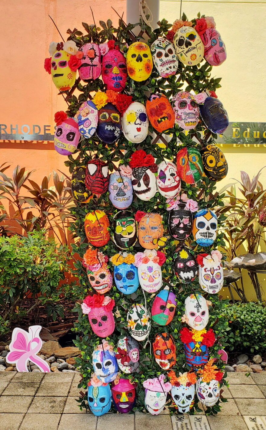 'Day of the Dead' grass wall installation outside the entrance to the Marco Island Center for the Arts.
