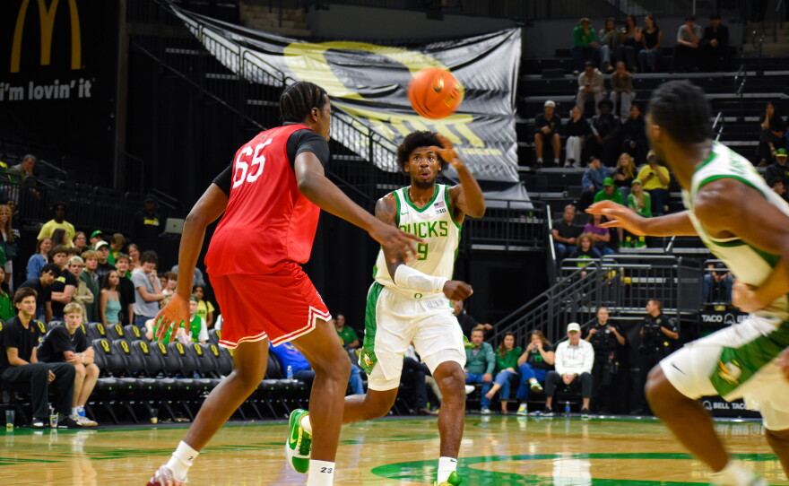 Oregon power forward Pharaoh Compton passes the ball over Seattle U center Halvine Dzellat in an exhibition game on Oct. 15, 2026 at Matthew Knight Arena in Eugene. Compton scored the most points for Oregon with 15 in the game.