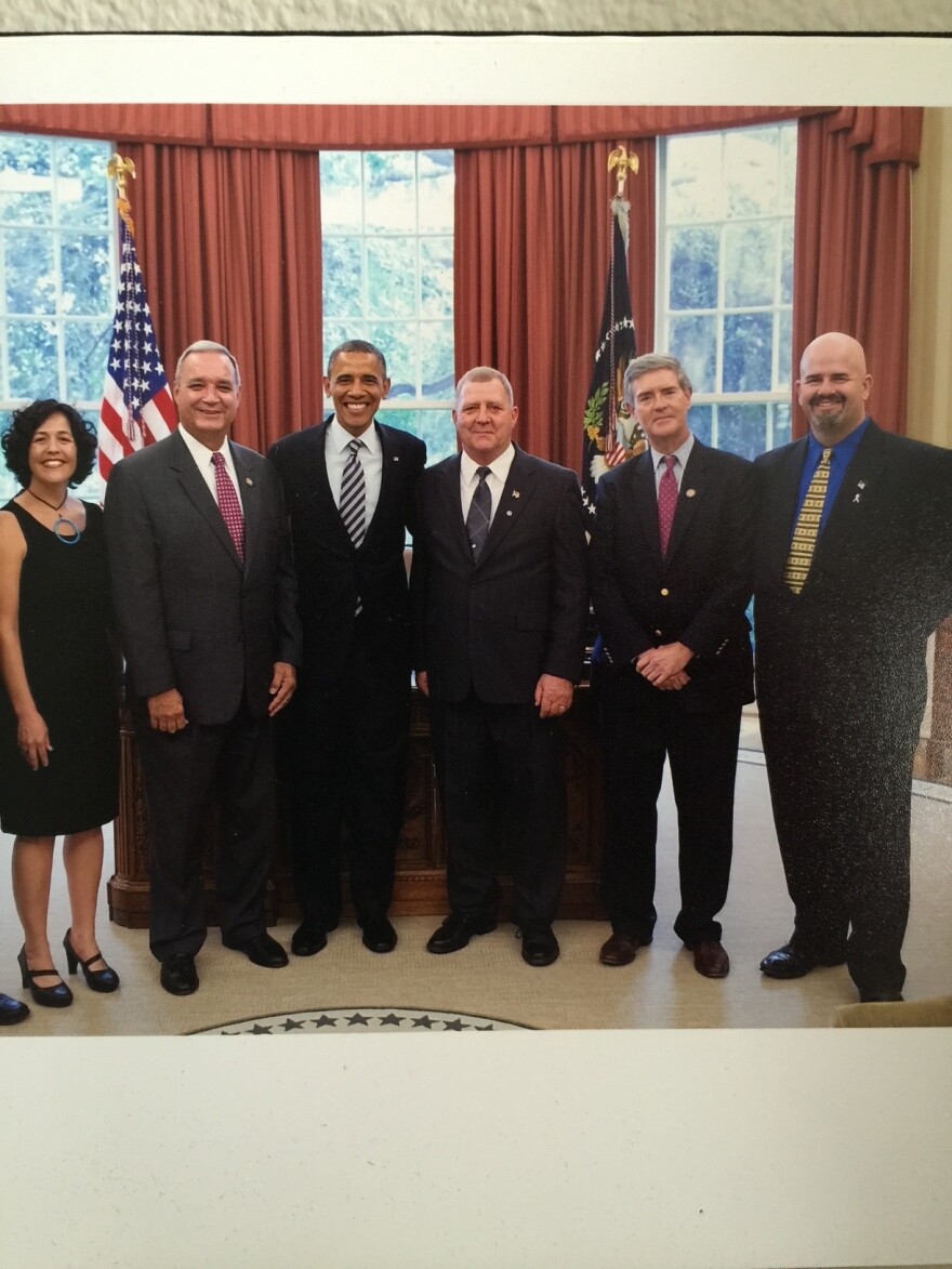 President Barack Obama signed the Janey Ensminger Act—formally part of the Honoring America's Veterans and Caring for Camp Lejeune Families Act of 2012—into law on August 6, 2012. This law provided medical care to veterans and family members exposed to contaminated water at Camp Lejeune between 1957 and 1987.