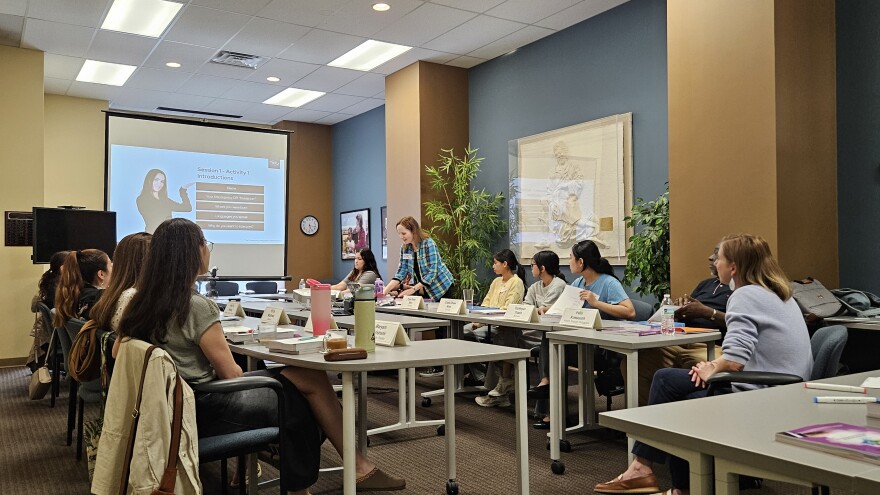 Students from the program listen during one of the presentations.