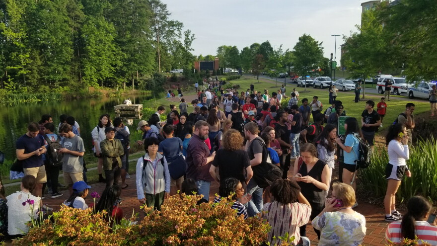 UNCC students and staff gathered in groups around campus after a shooter opened fire in a classrom.