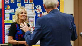 First lady Jill Biden and Wisconsin Gov. Tony Evers talk during a stop at Westside Academy Wednesday, Oct. 12, 2022, in Milwaukee. (AP Photo/Morry Gash)