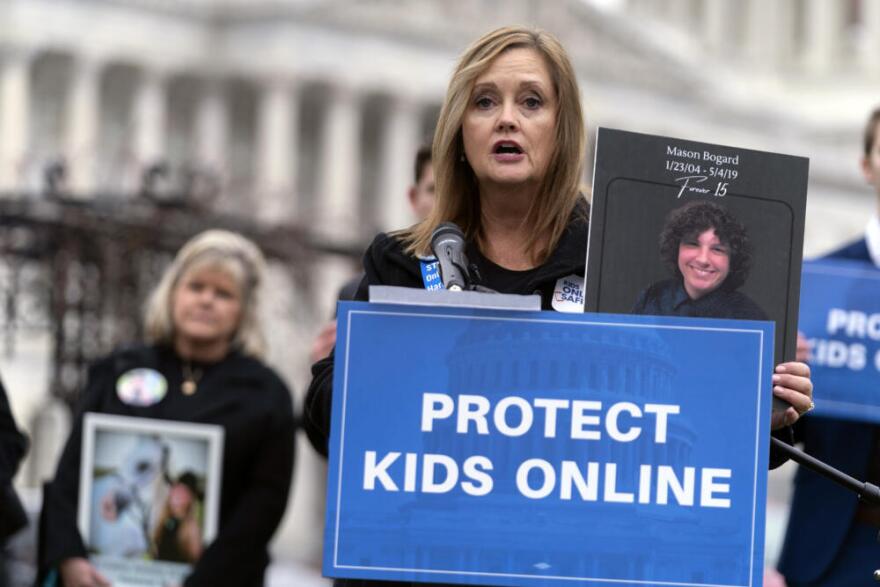 Joann Bogard holds a photo of her 15-year-old son Mason as she speaks during a Rally to Protect Kids Online on Capitol Hill in Washington, Wednesday, Jan. 31, 2024. (Jose Luis Magana/AP)