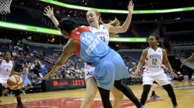 Atlanta Dream guard Angel McCoughtry (35) passes around Washington Mystics forward Ally Malott (11) in Washington, D.C., earlier this month.