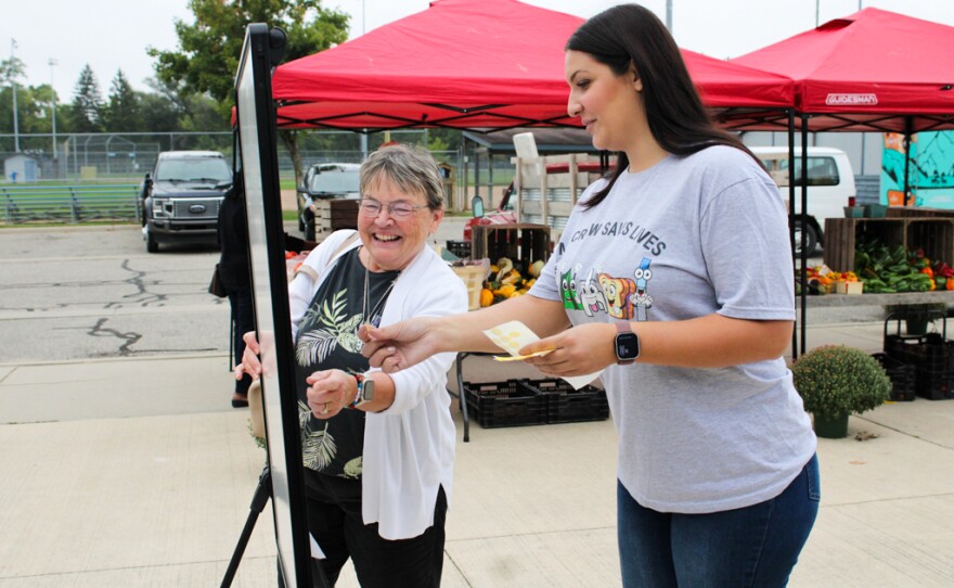 Nadia Ashtari asks a visitor how confident she is responding to an overdose during the national Save a Life Day event in Island Park, Mount Pleasant, Michigan on Thursday, September 25, 2025.