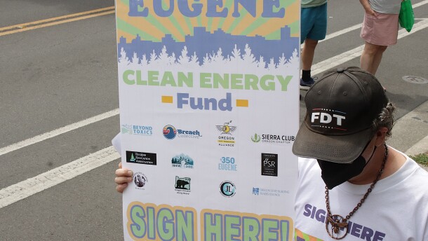 Eugene Clean Energy Fund supporters march through downtown Eugene, July 21, 2026.