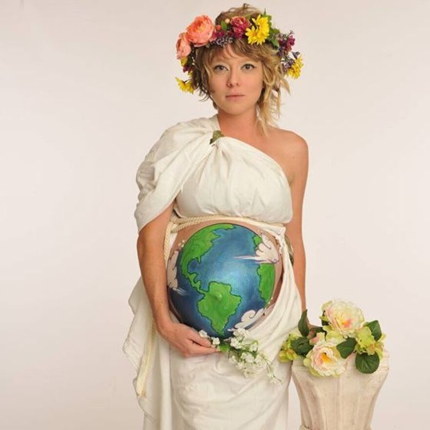 Heather Nicole Artrip — who lives in Stuart, Fla., and listens to NPR member station WQCS — dresses as Mother Earth for Halloween. "I made the head piece and toga from thrift store finds," Heather says. "It took me awhile to figure out a good way to wear the sheet and have it and expose my midsection. Then my friend painted the Earth on my big pregnant belly.