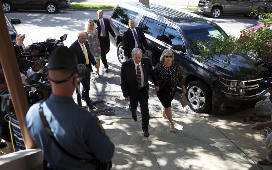 Missouri Gov. Mike Parson (center) and First Lady Teresa Parson (right), seen in this June 2018 photograph, tested positive for the coronavirus on Wednesday. 