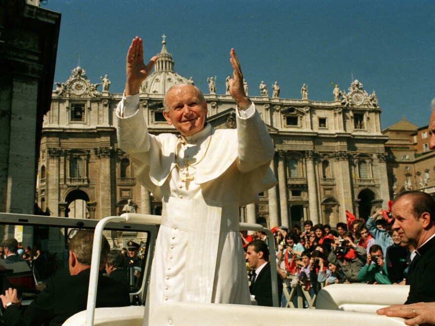 Pope John Paul II waves to the faithful during his general audience in St. Peter's Square on March 29, 1989. Archbishop Timothy Dolan says "there was something mystical, there was something transcendent, there was something unique" about the late pope.