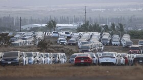 FILE — Unused rental cars fill a dusty field near Kahului Airport, Friday, Sept. 1, 2023, on Maui.
