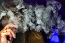 U.S. health officials are again urging people to stop vaping until experts figure out why some are coming down with serious respiratory illnesses.