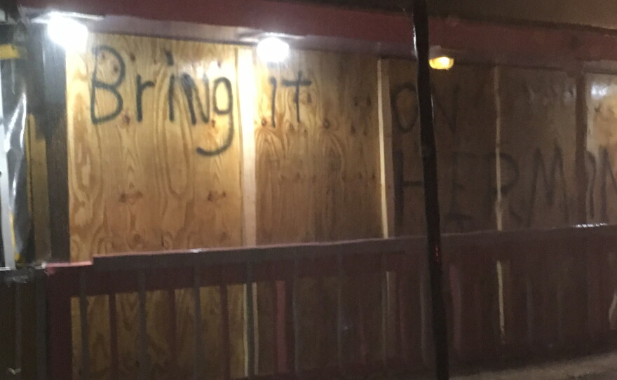 "Bring it on Hermine," reads a spray-painted greeting on a Cedar Key building. This photo was taken the night the storm made landfall, and just before Florida Highway Patrol closed the only road to the island. (Ryan Roberts/WUFT News)