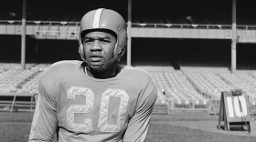 FILE - In this Nov. 2, 1950, file photo, New York Yanks football player George Taliaferro poses in New York. Taliaferro, a standout running back for Indiana who became the first black player to be drafted by an NFL team when George Halas and the Chicago Bears took him in the 13th round of the NFL draft, has died.