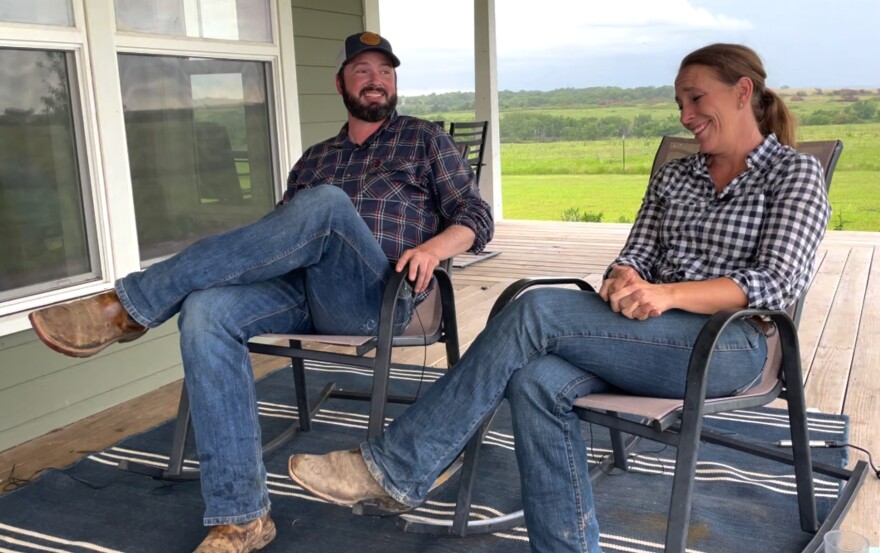 A photograph of Jay and Sara Shivers, sitting for an interview on the porch of their home at Salt Creek Farm near Severy, Kansas.